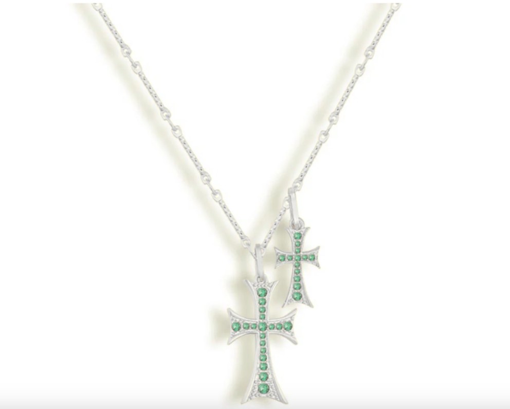 From Clean Cuts to Symbolic Style: The Rise of the Crossed Necklace